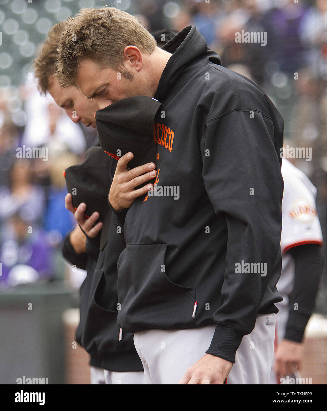 Members of the San Francisco Giants pause for a moment of silence for baseball great Harmon Killebrew, who passed away, at Coors Field in Denver on May 17, 2011.    UPI/Gary C. Caskey Stock Photo