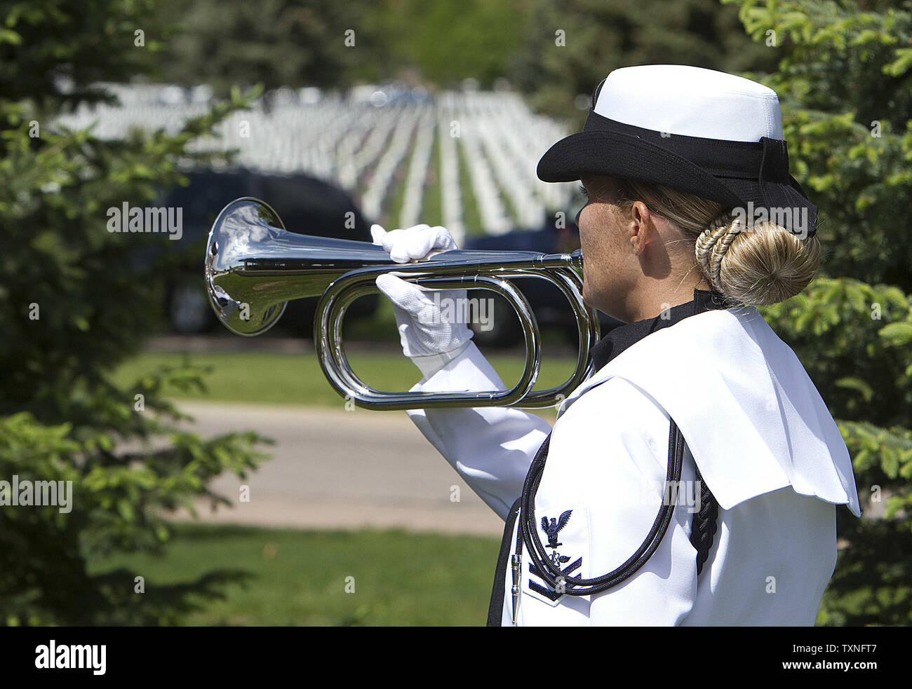 Taps is played during a U.S. Navy funeral taking place at Fort Logan as  preparation for Memorial Day continue at Fort Logan National Cemetery in  Denver on May 28, 2011. Memorial Day