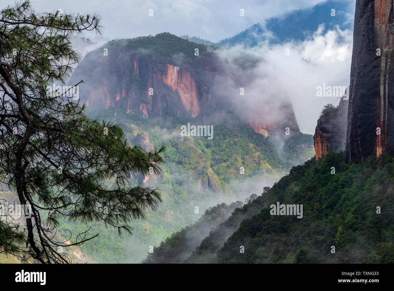 Landscape with low cloud over Thousand Turtle mountain, elevated view, Lijiang, Hunan Province, China Stock Photo
