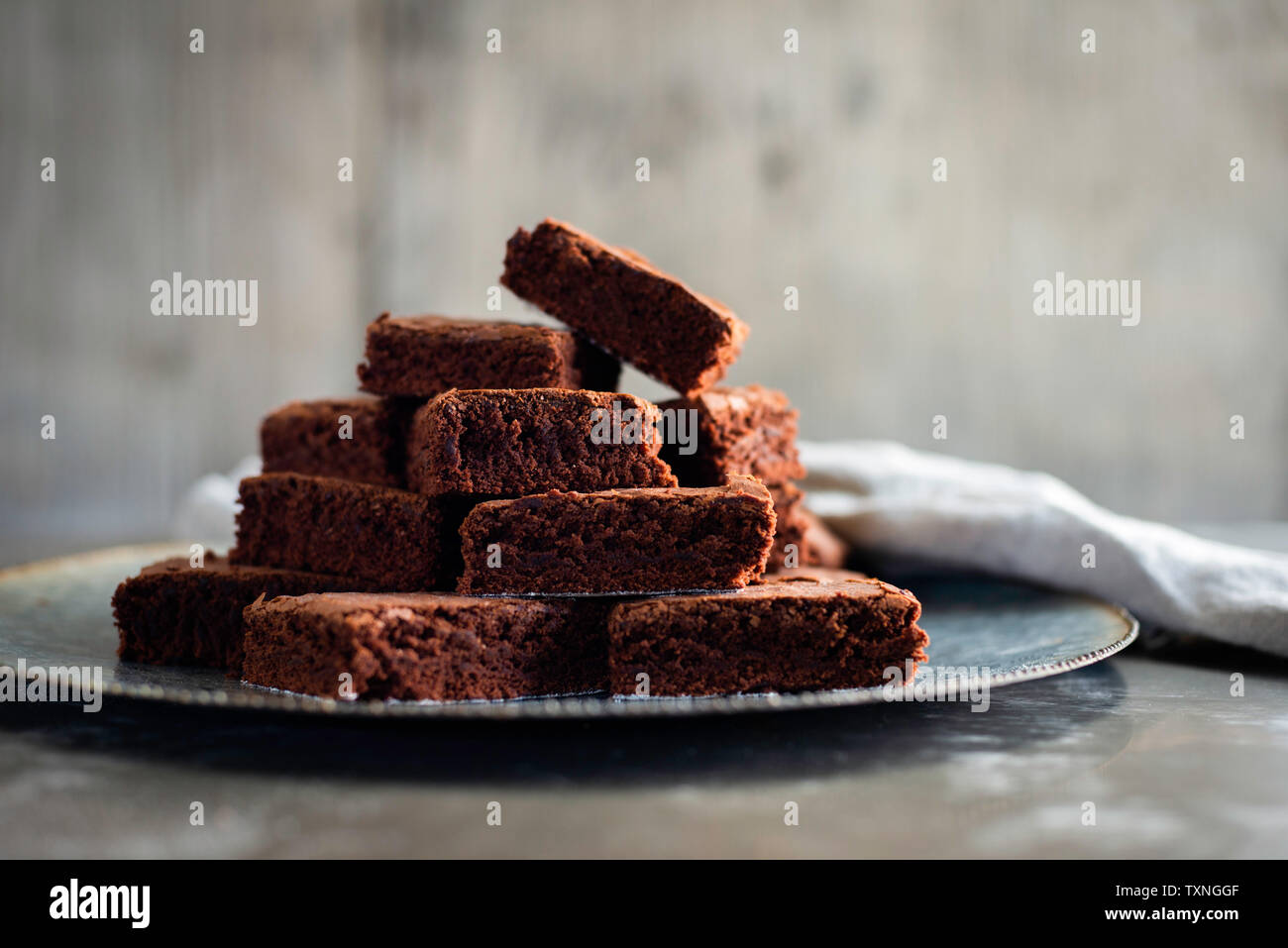Chocolate brownies on plate with napkin Stock Photo