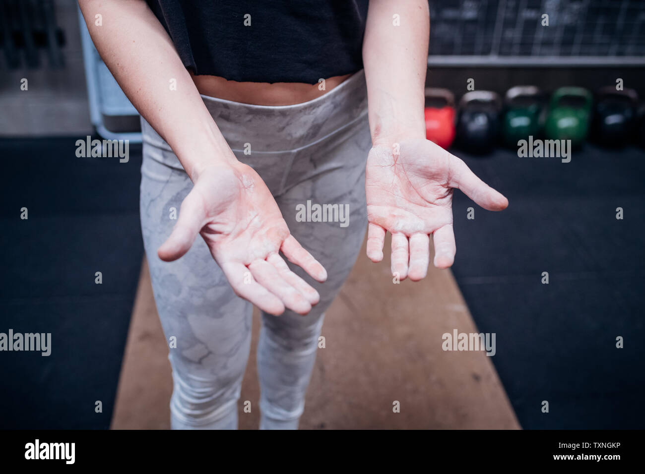 Young woman showing calluses on palms in gym Stock Photo Alamy