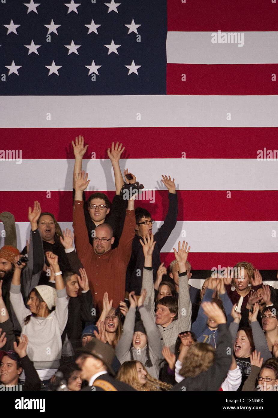 Supporters sitting behind the speaker's podium do the 'Wave' prior to the arrival of President Barack Obama at the Tivoli Events Center of the Aurarian campus in Denver on October 26, 2011.   President Obama spoke of easing the burden of repaying student loans to students and faculty at the downtown college campus.    UPI/Gary C. Caskey Stock Photo