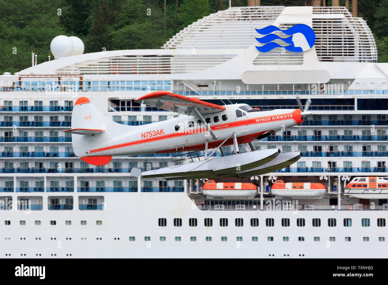 Float plane passing Cruise Ship, Juneau, Alaska, USA Stock Photo Alamy