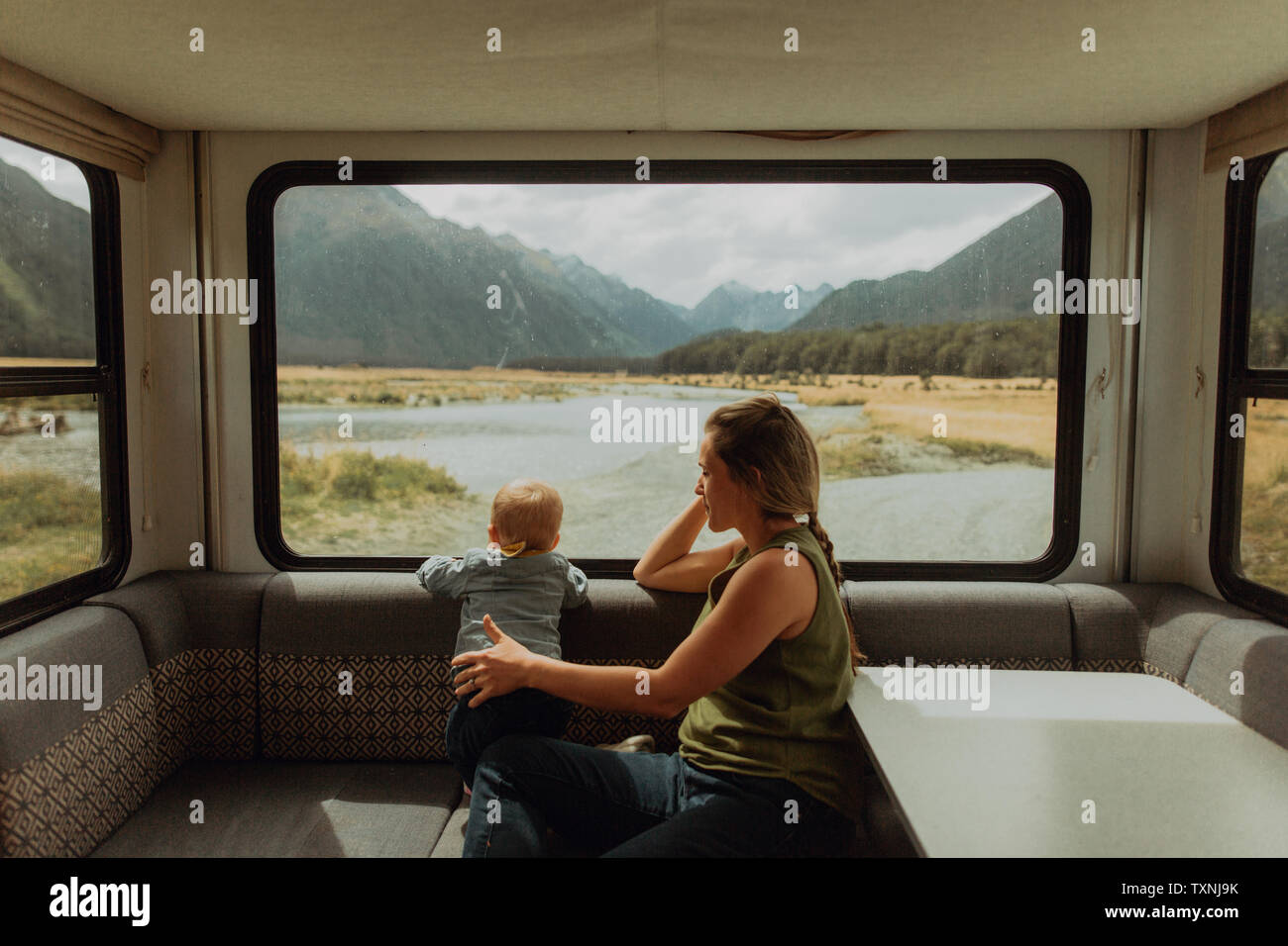 Mother and baby relaxing in motorhome, Queenstown, Canterbury, New