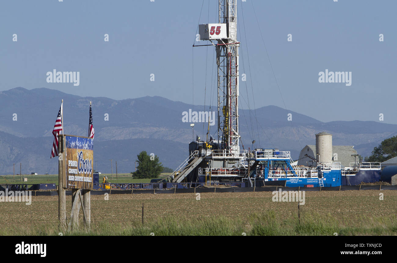 An oil rig stands on farmland that grows barley for Coors Brewery at
