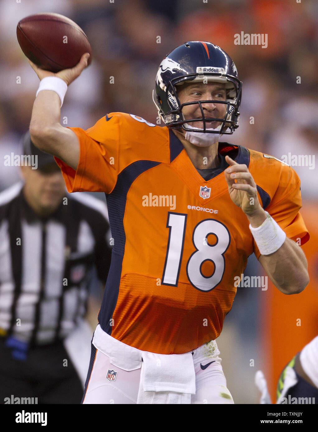 Denver Broncos Peyton Manning throws against the New England Patriots  during the AFC Championship game at Sport Authority Field at Mile High in  Denver on January 24, 2016. Denver advances to Super