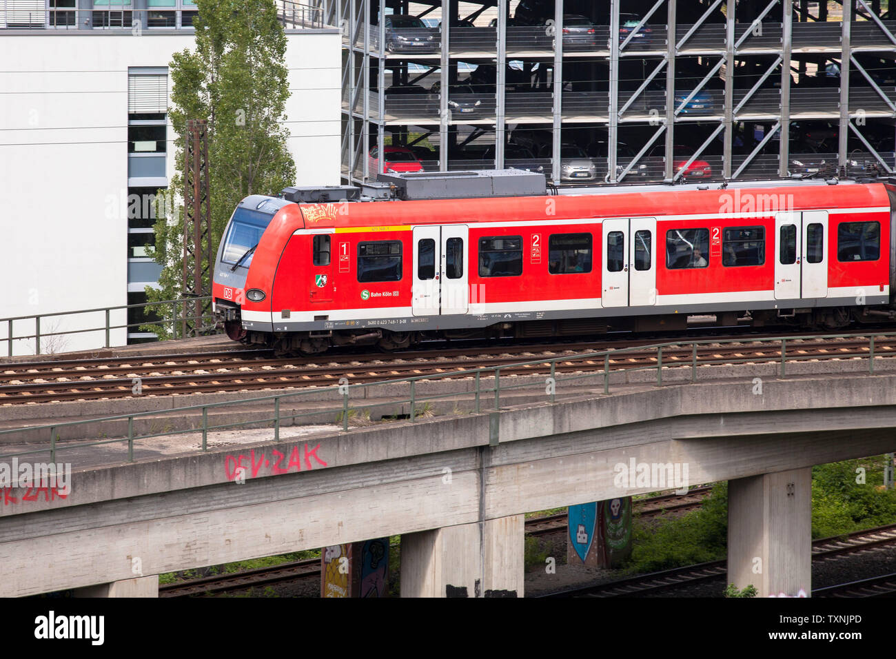 suburban train in the town district Deutz, Cologne, Germany.  S-Bahn im Stadtteil Deutz, Koeln, Deutschland. Stock Photo