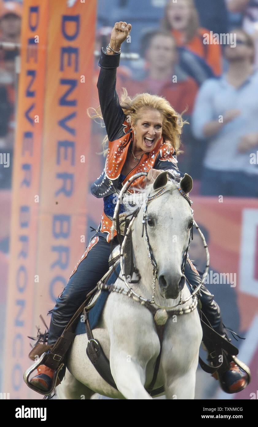 Thunder, a purebred Arabian gelding and the Denver Broncos live mascot, enters the stadium ridden by Ann Judge-Wegener at Sports Authority Field at Mile High in Denver on September 23, 2013.  Denver hosts AFC divisional rival Oakland for Monday Night Football.    UPI/Gary C. Caskey Stock Photo