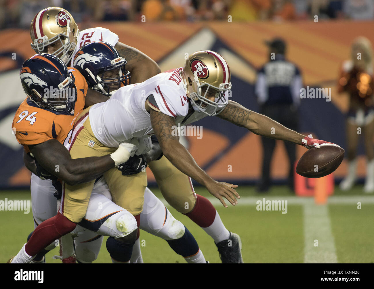 Denver Broncos linebacker DeMarcus Ware (94) sacks San Francisco 49ers quarterback Colin Kaepernick in the end zone for a safety during the second quarter during pre-season game three at Sports Authority Field at Mile High in Denver on August 29, 2015.  Photo by Gary C. Caskey/UPI Stock Photo