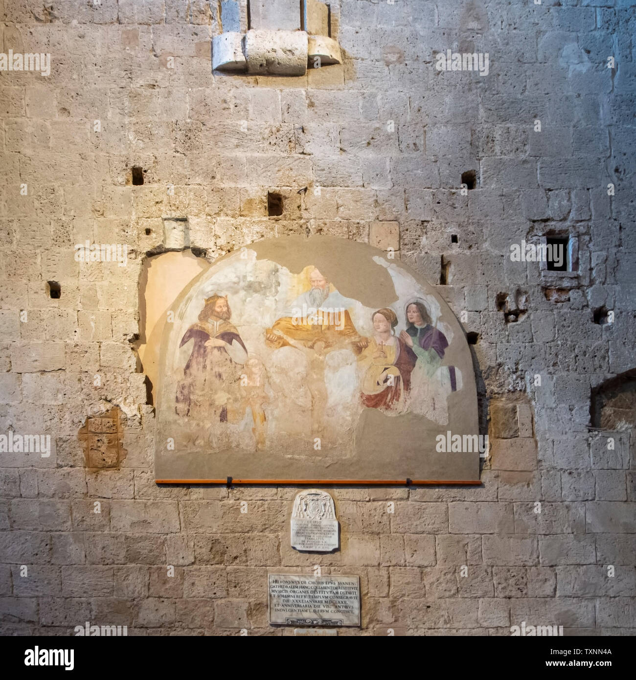 SOVANA, TUSCANY, ITALY - JUNE 16, 2019 - Ancient artwork in the Concattedrale dei Santi Pietro e Paolo aka Duomo Cathedral of Sovana. Stock Photo