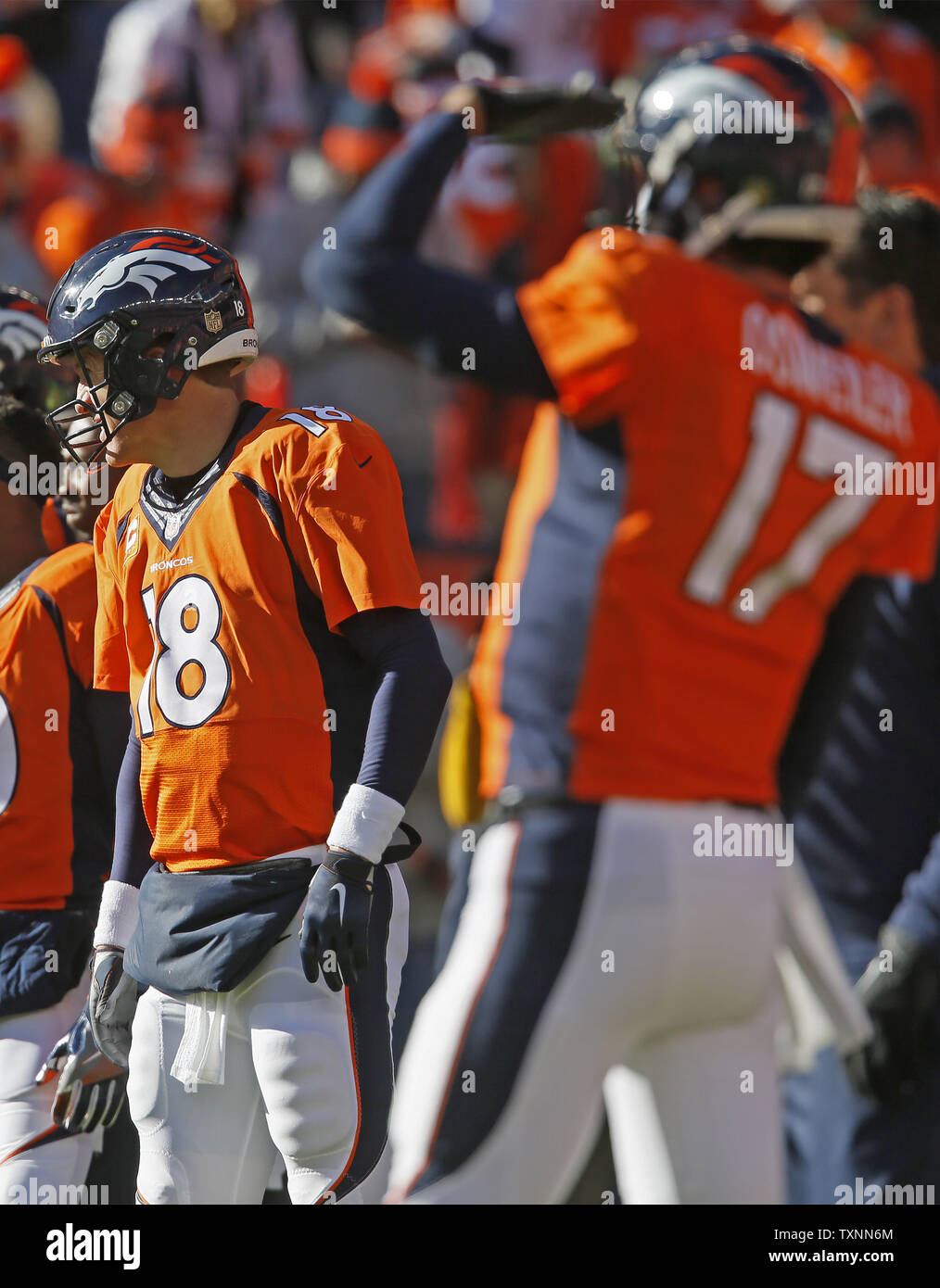 Denver Broncos Peyton Manning (L) and Brock Osweiler warm up before ...