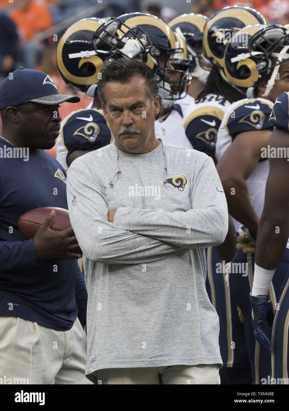 Los Angeles Rams head coach Jeff Fisher watches team warm up during pre-season game three at Sports Authority Field at Mile High in Denver on August 27, 2016.   Photo by Gary C. Caskey/UPI Stock Photo
