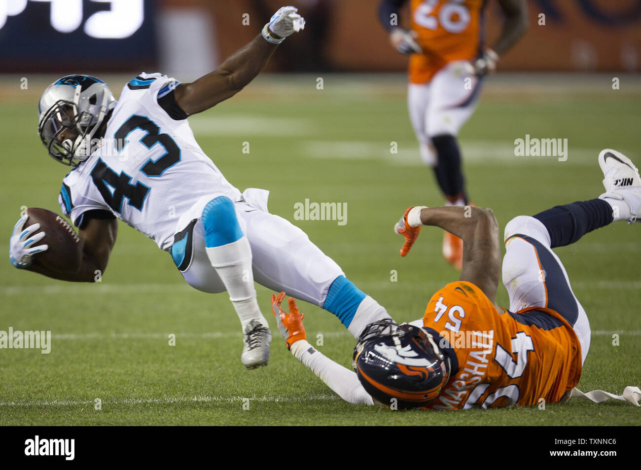 Carolina Panthers running back Fozzy Whittaker (43) gains four yards on a pass reception against Denver Broncos linebacker Brandon Marshall in the second quarter at the NFL's season opener and Super Bowl 50 rematch at Sports Authority Field at Mile High in Denver on September 8, 2016.  Newton is the NFL 2015 MVP.   Photo by Gary C. Caskey/UPI Stock Photo
