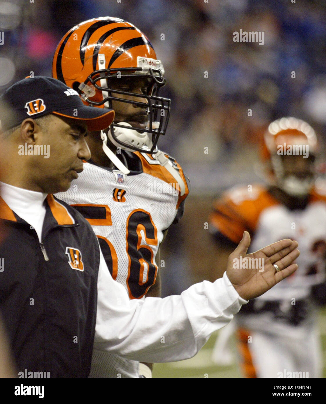 Cincinnati Bengals head coach Marvin Lewis talks with line backer Brian Simmons (56) after the defense let up a fourth quarter touchdown run to the Detroit Lions December 18, 2005 at Ford Field in Detroit.  (UPI Photo/Scott R. Galvin) Stock Photo
