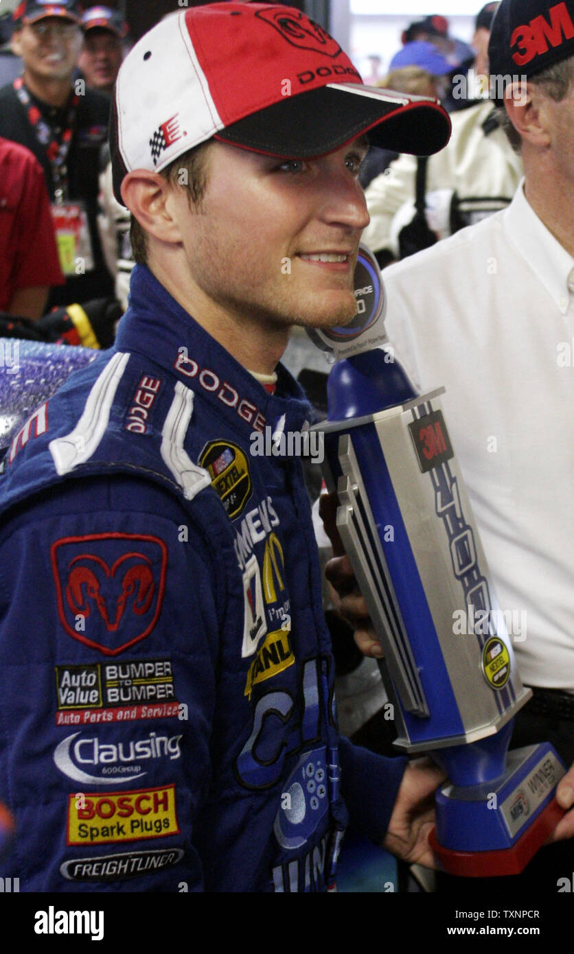 Nascar driver Kasey Kahne holds his victory trophy for the 3M Performance 400 at The Michigan International Speedway in Brooklyn, Mi on June 18, 2006.  Kahne won the race after it was called due to heavy rain after lap 129.  (UPI Photo/Scott R. Galvin) Stock Photo