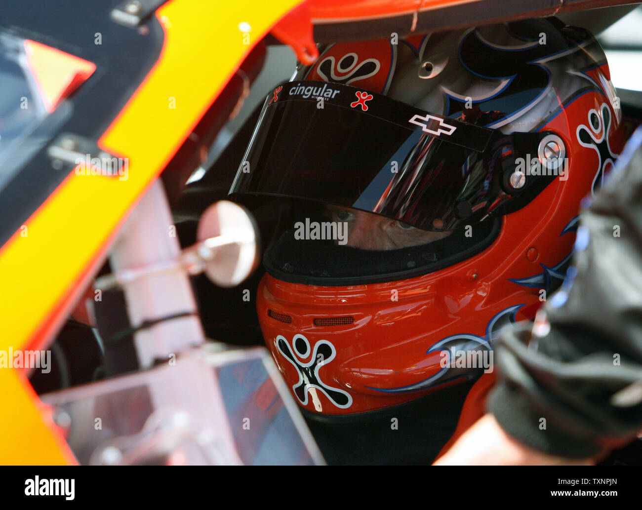 Nascar driver Jeff Burton sits in his car waiting for the start of the GFS  Marketplace 400 at the Michigan International Speedway in Brooklyn,  Michigan on August 20, 2006. Burton started in