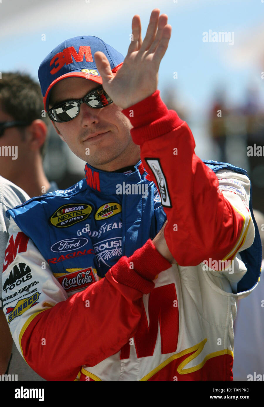 Nascar driver Todd Kluever waves during driver introductions for the GFS Marketplace 400 at the Michigan International Speedway in Brooklyn, Michigan on August 20, 2006.  Kluever did not finish the race due to an accident in lap 10. (UPI Photo/Scott R. Galvin) Stock Photo