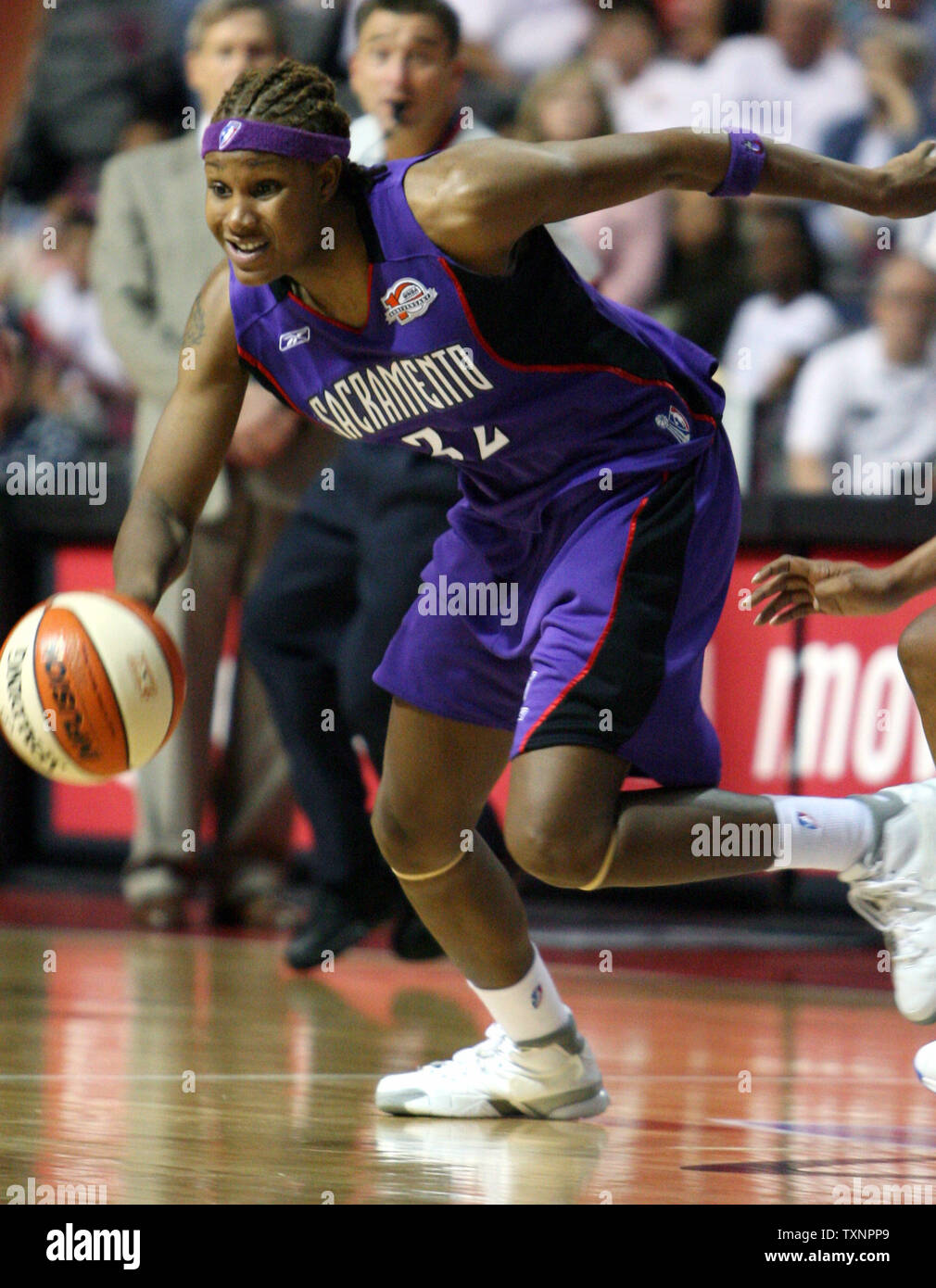 Sacramento Monarchs forward Rebekkah Brunson, right, goes to