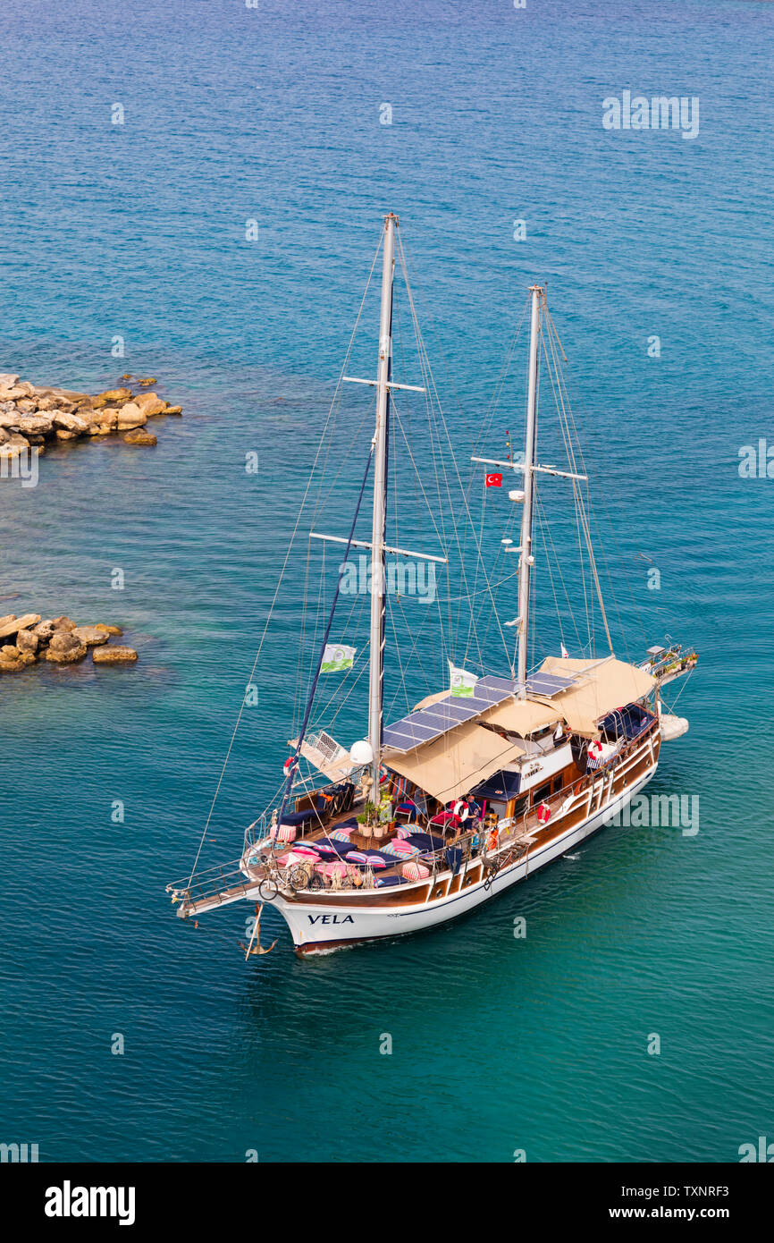 Pleasure day trip boat “Vela” at the entrance to Kyrenia Harbour, Girne, Turkish Republic of Northern Cyprus. Stock Photo