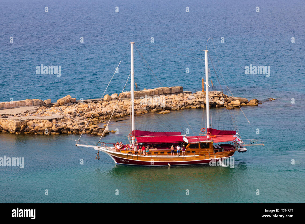 Pleasure day tripper boat “luna” entering Kyrenia harbour, Girne, Turkish Republic of Northern Cyprus. Stock Photo
