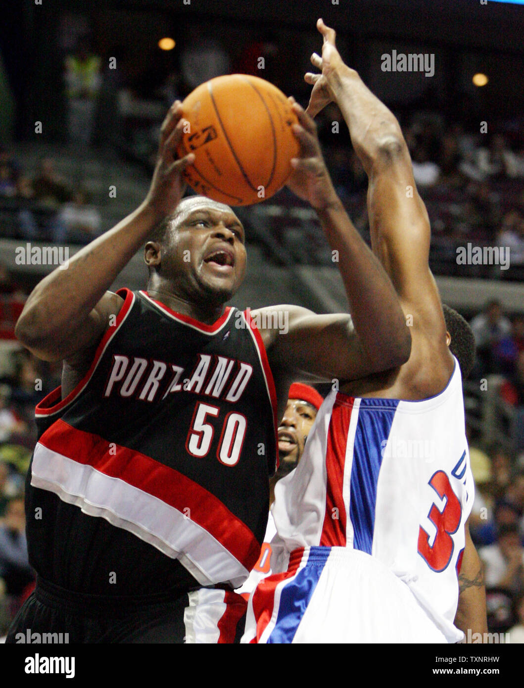 Portland Trail Blazers forward Zach Randolph (50) leaps past Detroit Pistons forward Dale Davis for a shot in the third quarter at The Palace of Auburn Hills in Auburn Hills, Michigan on December 5, 2006.  Randolph scored 31 points in the Trail Blazers' 88-85 victory over the Pistons.  (UPI Photo/Scott R. Galvin) Stock Photo