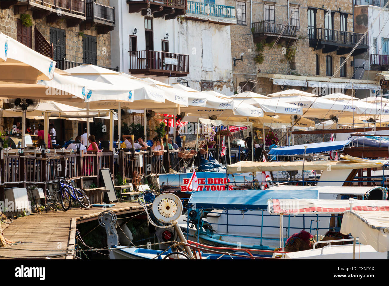 tavernas line the harbour front, Kyrenia, Girne, Turkish Republic of Northern Cyprus. Stock Photo