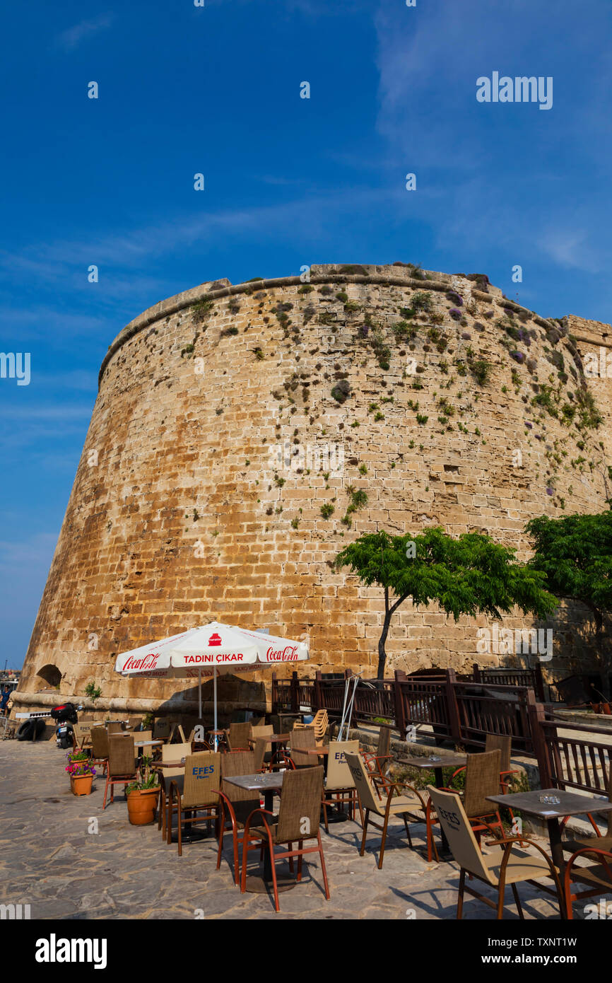 outdoor cafe bar against the walls of Kyrenia Castle, Girne, Turkish Republic of Northern Cyprus. Stock Photo
