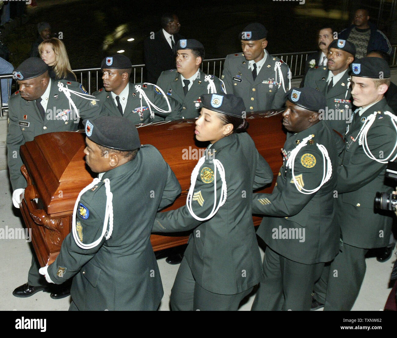 A military color guard carries the coffin of Rosa Parks out of the Charles H. Wright Museum of African American History November 2, 2005, to load into the hearse and head to the Greater Grace Temple in Detroit for the funeral.  (UPI Photo/Scott R. Galvin) Stock Photo
