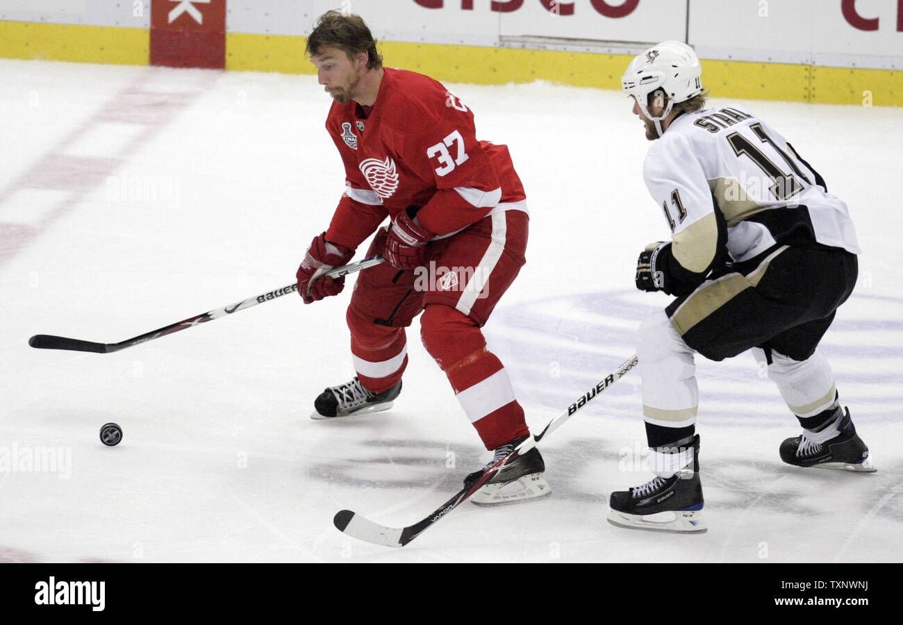 Pittsburgh Penguins Jordan Staal (11) gets tanged up with New Jersey Devils  Mike Mottau during the third period at the Mellon Arena in Pittsburgh on  April 1, 2009. .(UPI Photo/Stephen Gross Stock