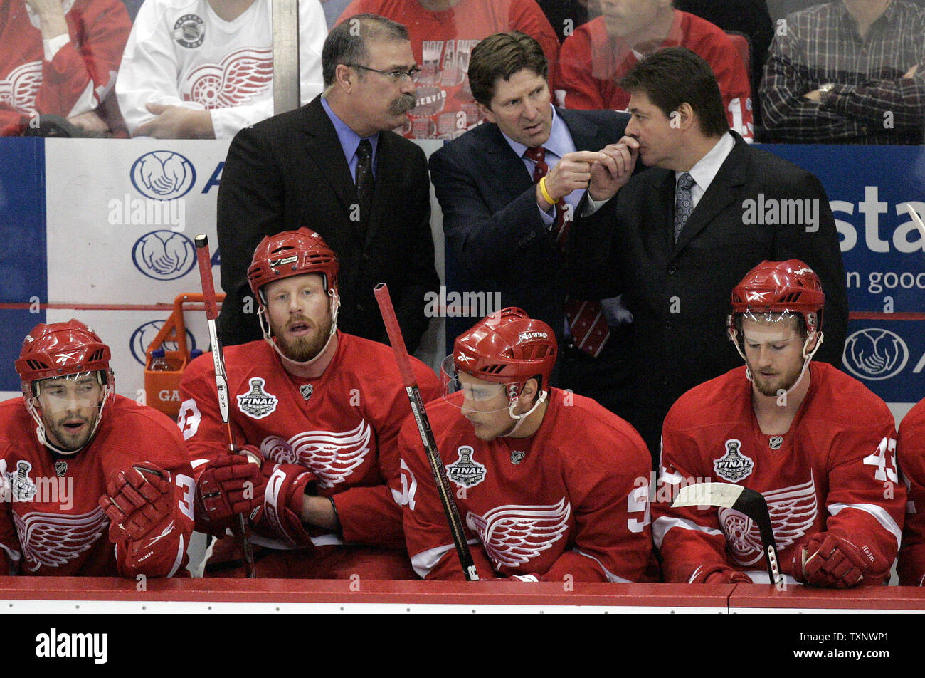 Detroit Red Wings head coach Mike Babcock, center, with assistant coaches Paul MacLean, left, and Brad McCrimmon, right, discuss power play strategy during the first period of game 5 of the 2009 Stanley Cup Final against the Pittsburgh Penguins at Joe Louis Arena in Detroit on June 6, 2009. (UPI Photo/Mark Cowan) Stock Photo