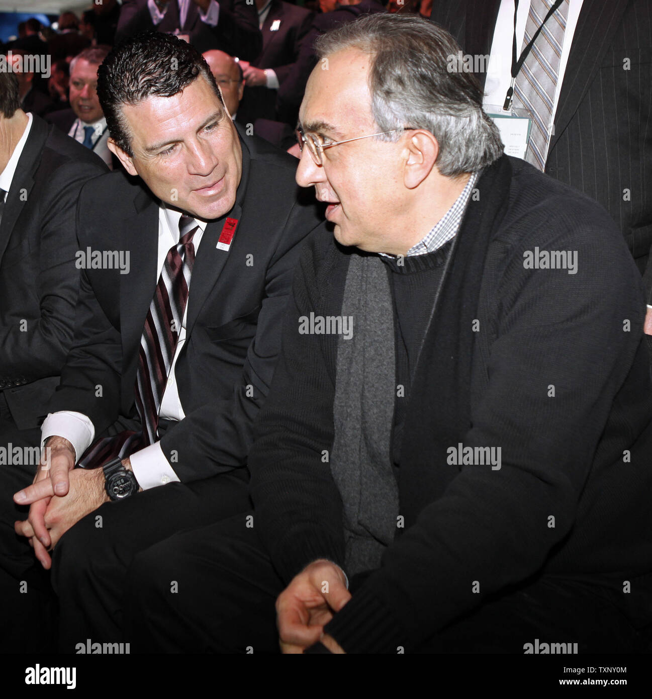 Reid Bigland, President and CEO of Dodge, left, talks with Sergio Marchionne, CEO of the Fiat Group and Chrysler before the Jeep presentation during the 2013 North American International Auto Show at the Cobo Center in Detroit, January 14, 2013. UPI/Mark Cowan Stock Photo