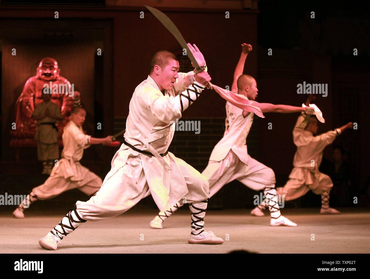 Chinese monks display their Kong Fu skills at the Shaolin Temple Wushu (martial  arts) Training Center in Denfeng City, Henan Province November 13, 2011.  Shaolin monks have been practicing Kung Fu for, image size:1300x979