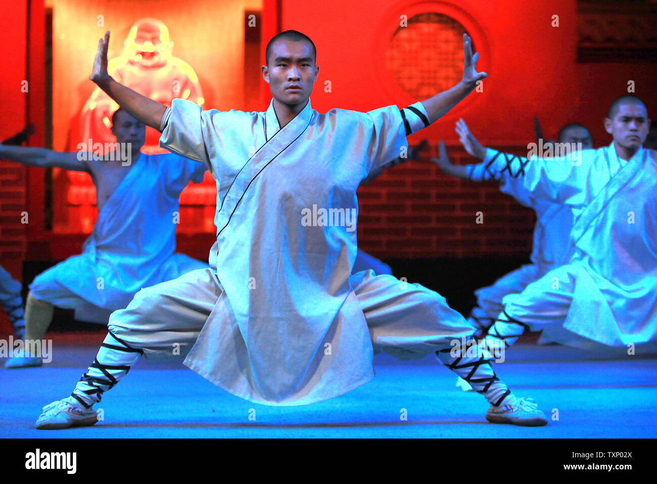 Chinese monks display their Kong Fu skills at the Shaolin Temple Wushu (martial  arts) Training Center in Denfeng City, Henan Province November 13, 2011.  Shaolin monks have been practicing Kung Fu for, image size:1300x959