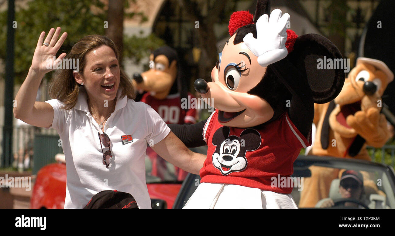 Olympic GoldMedalist and Professional Ice Skater, Dorothy Hamill, rides with Minnie Mouse in the celebrity motorcade down Hollywood Boulevard on July 31, 2004 at the Disney - MGM Studios in Orlando, Florida during the celebration of the ESPN Sports Network's 25th anniversary. (UPI Photo Marino / Cantrell Stock Photo