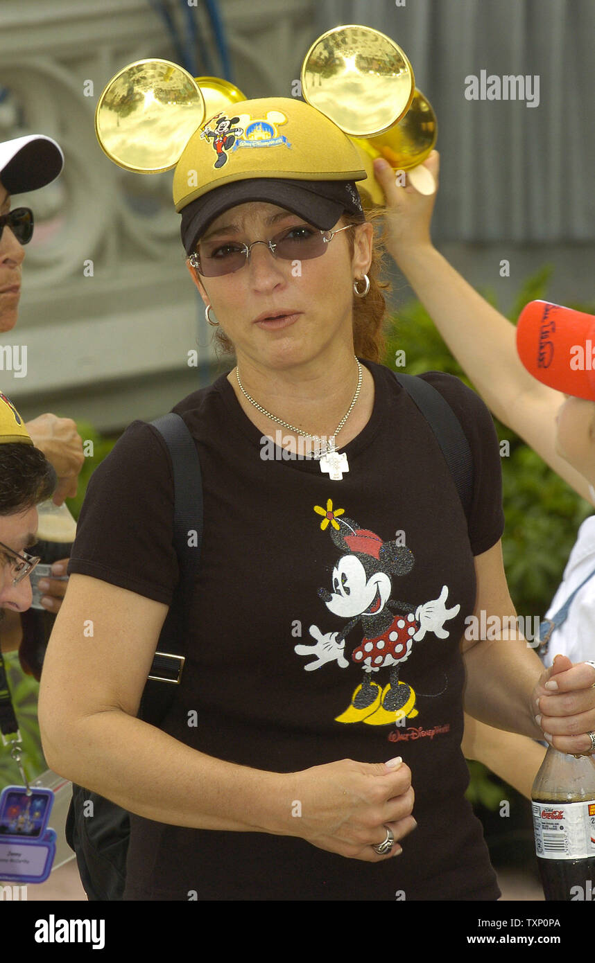 Gloria Estephan Wearing A Pair Of Gold Mickey Mouse Ears Is Among The Many Celebrities On Hand At Walt Disney World S Magic Kingdom Near Orlando Fl On May 5 05 To Celebrate