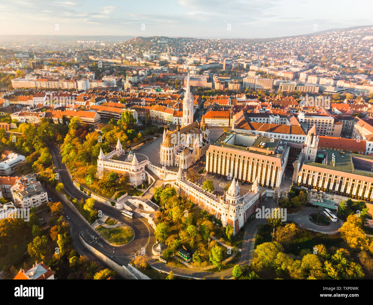 Aerial view of Fishermans Bastion and Matthias Church from above in Budapest during sunrise in autumn with dramatic sky (Budapest, Hungary, Europe) Stock Photo