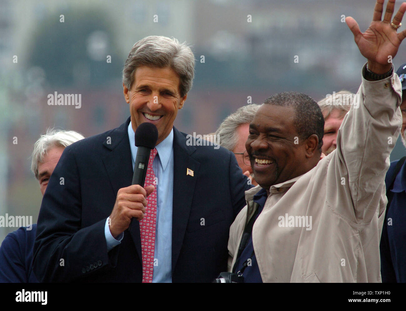 Democratic presidential hopeful John Kerry appears with Rev. David Alston and other members of his swift boat crew at a rally on July 28, 2004, in Boston. Kerry arrived this morning to his home state, where he will be formally nominated as the Democratic Presidential candidate at the Democratic National Convention on July 29.    (UPI Photo/Greg Whitesell) Stock Photo