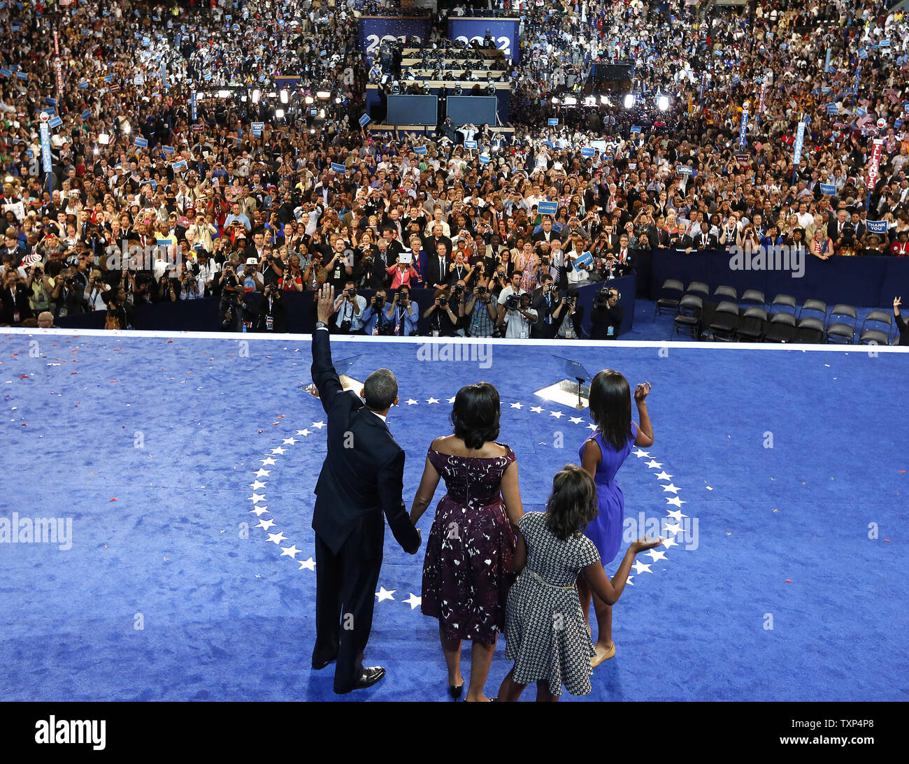 President Barack Obama and his family wave to the convention after giving his acceptance speech during the 2012 Democratic National Convention at the Time Warner Cable Arena in Charlotte, North Carolina on September 6, 2012.          UPI/Scott Andrews   POOL Stock Photo