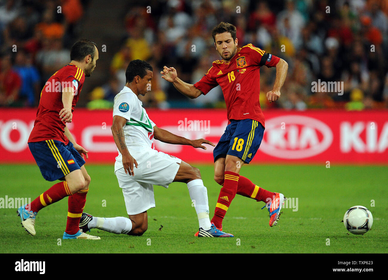 Jordi Alba and Andres iniesta of Spain in action with Nani of Portugal during the Euro 2012 Semi-Final match at Donbass Arena in Donetsk, Ukraine on June 27, 2012. UPI/Chris Brunskill Stock Photo