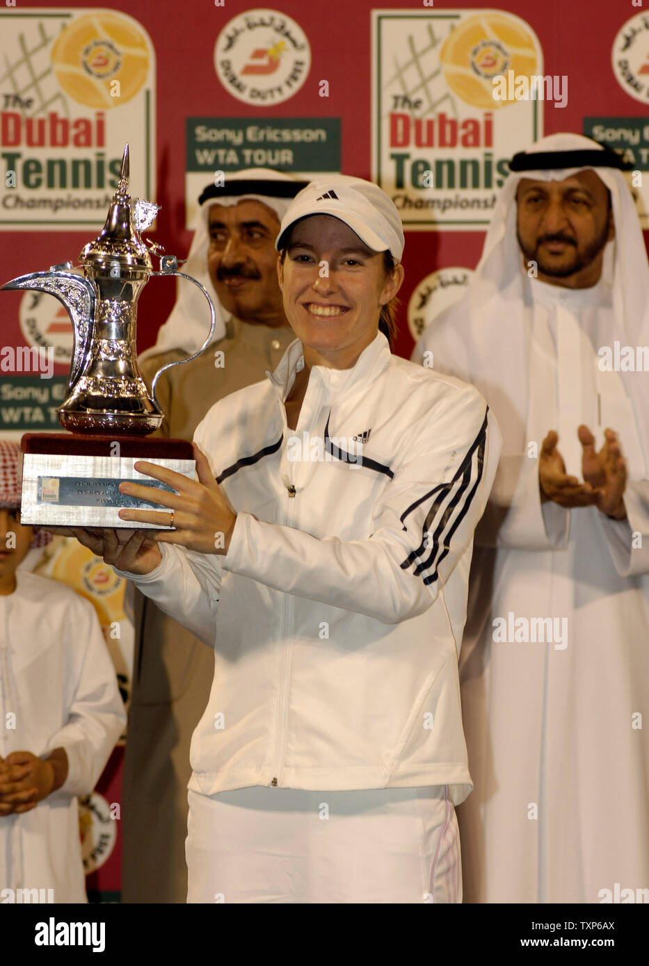 Justine Henin-Hardenne of Belgium seen with trophy after defeating Maria  Sharpova of Russia 7-5, 6-2 in the finals of the Dubai Tennis Championships  in Dubai, United Arab Emirates on February 25, 2006.
