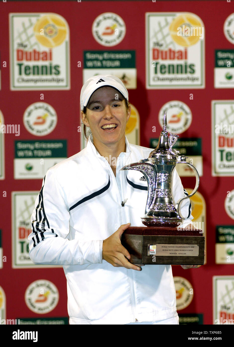Justine Henin-Hardenne of Belgium seen with trophy after defeating Maria  Sharpova of Russia 7-5, 6-2 in the finals of the Dubai Tennis Championships  in Dubai, United Arab Emirates on February 25, 2006.