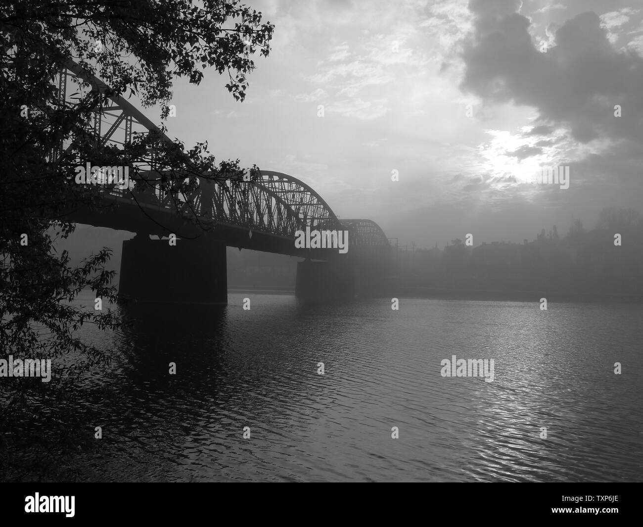 Railway bridge in Prague in the foggy morning Stock Photo