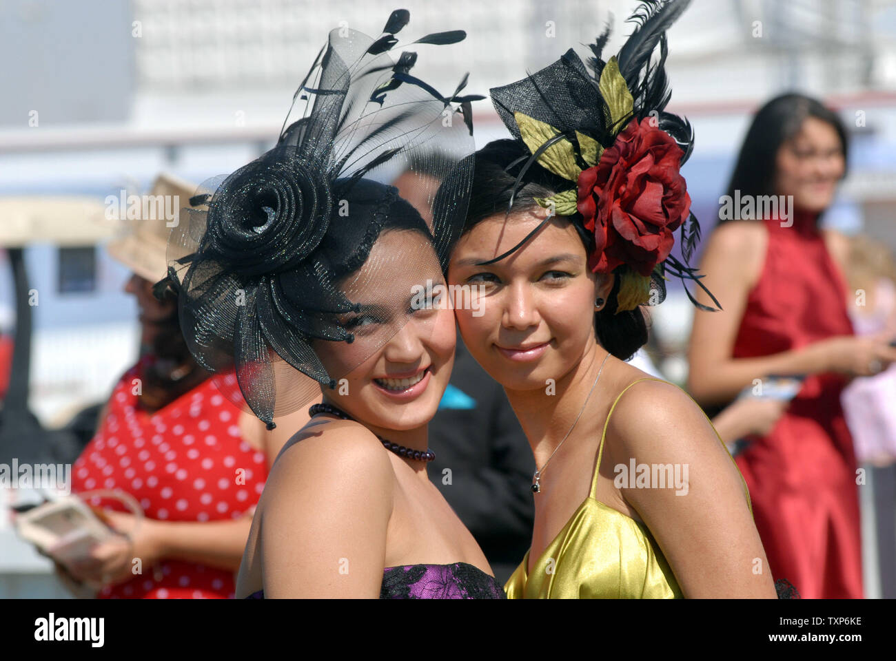 Foreign women display their hats in competition during the 12th Dubai World  Cup, the richest horse race in the world with a total purse of 21.25  Million U.S. dollar on Saturday March