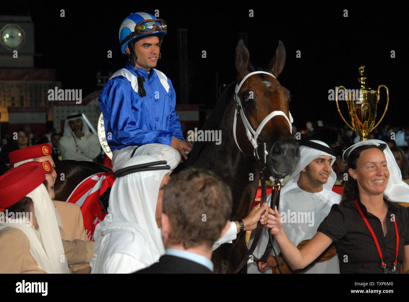 Jockey Fernado Jara sits on Invasor (7), owned by the deputy ruler of Dubai and UAE Minister of Finance and Industry, Sheikh Hamdan bin Rasid Al Maktoum, after winning the final six million dollar prize at the 12th Dubai World Cup on March 31, 2007. The one day, seven race Dubai World Cup is the richest horse race in the world with a total purse worth over 21 million U.S. dollars. (UPI Photo/Kamal Moghrabi) Stock Photo