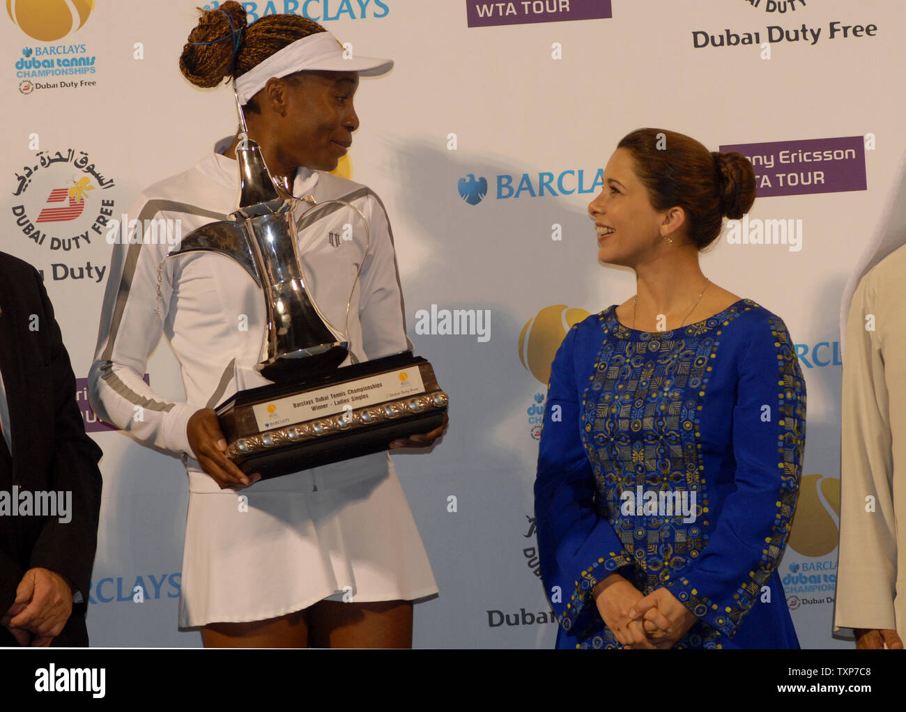The world No. 6, Venus Williams hold her trophy after it was presented to her by Princess Haya (R) the wife of the ruler of Dubai, Sheikh Mohammed bin Rashid El Maktoum. Williams defeated Virginie Razzano from France in the finals of the Women's Dubai Championships, Saturday February 21, 2009.  Williams won the match 6-4, 6-2. (UPI Photo/Norbert Schiller) Stock Photo