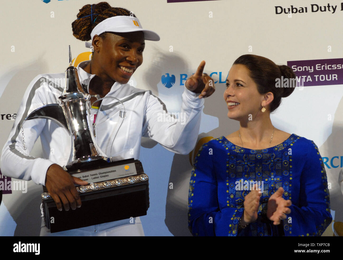 The world No. 6, Venus Williams hold her trophy after it was presented to her by Princess Haya (R) the wife of the ruler of Dubai, Sheikh Mohammed bin Rashid El Maktoum. Williams defeated Virginie Razzano from France in the finals of the Women's Dubai Championships, Saturday February 21, 2009.  Williams won the match 6-4, 6-2. (UPI Photo/Norbert Schiller) Stock Photo