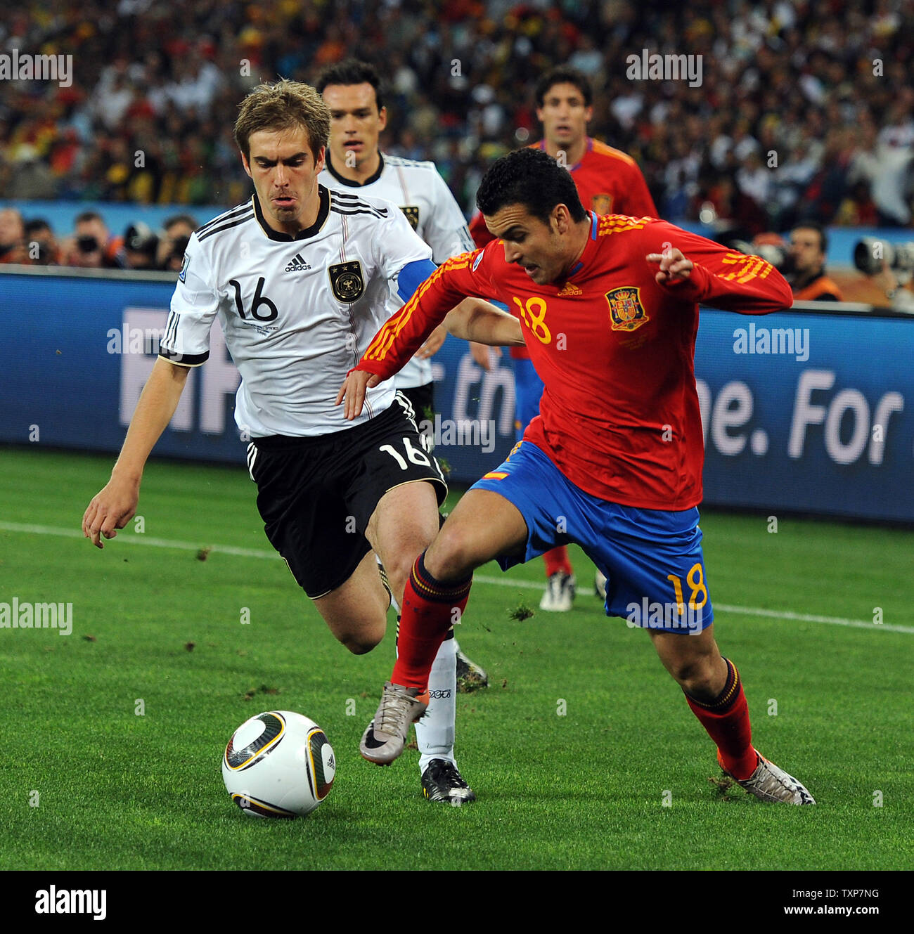 Philipp Lahm of Germany and Pedro of Spain during the FIFA World Cup Semi Final match at the Moses Mabhida Stadium in Durban, South Africa on July 7, 2010. UPI/Chris Brunskill Stock Photo