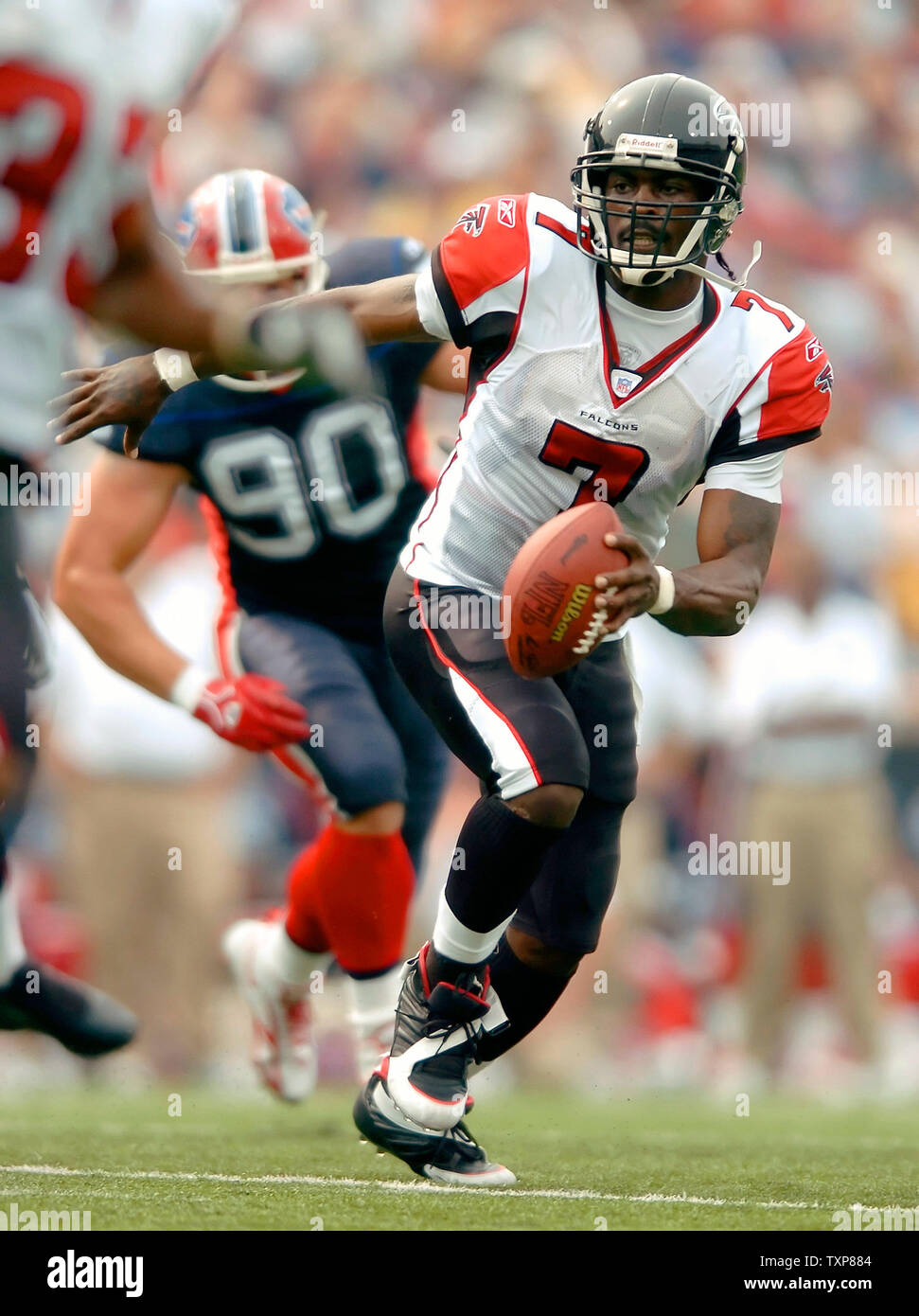 Atlanta Falcons QB Michael Vick rolls out looking for a receiver against  the Buffalo Bills on September 25, 2005. The Falcons, defeated the Bills  24-16, in the matchup at Ralph Wilson Stadium