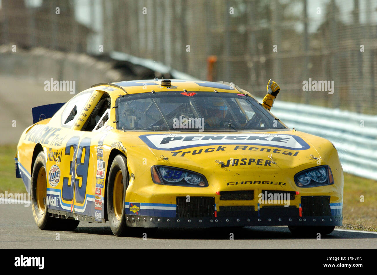 Kurt Busch In Car Number 39 Holds His Fist Up In Victory After Finishing The Nascar