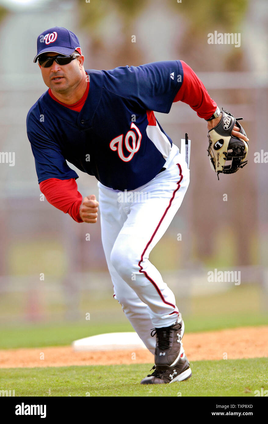 Adam Dunn of the Washington Nationals looks at his son Brady Dunn